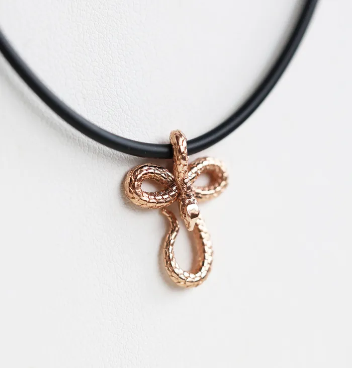 Capucinne Necklaces Mens snake necklace with natural rubber cord and smaller pendant