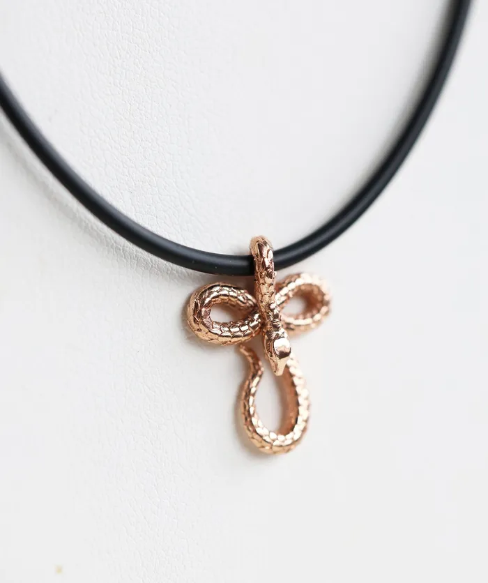 Capucinne Necklaces Mens snake necklace with natural rubber cord and smaller pendant