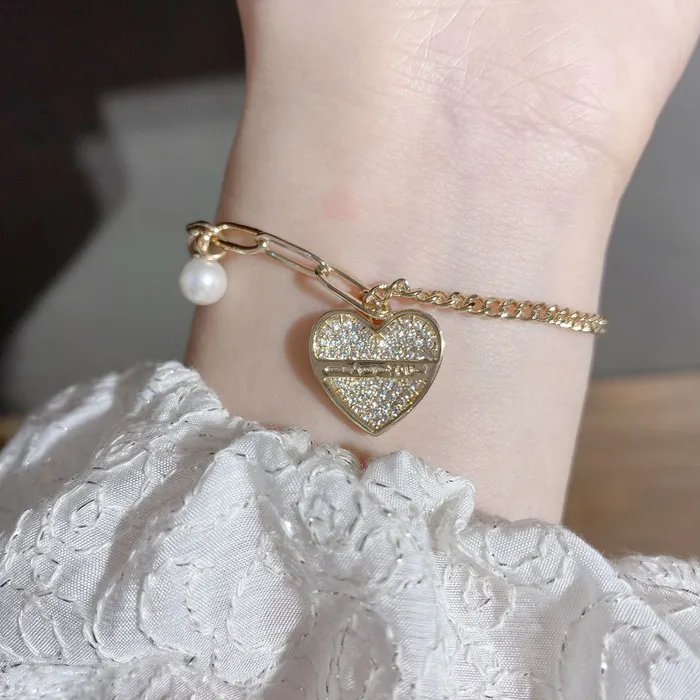 Refined by AnnaKaci Bracelets Heart Pendant Asymmetrical Bracelet with Pearl Refined by AnnaKaci Bracelets Heart Pendant Asymmetrical Bracelet with Pearl
